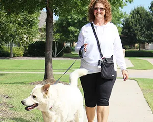 Stonebridge Ranch Community Association Marie Shook walking her dog