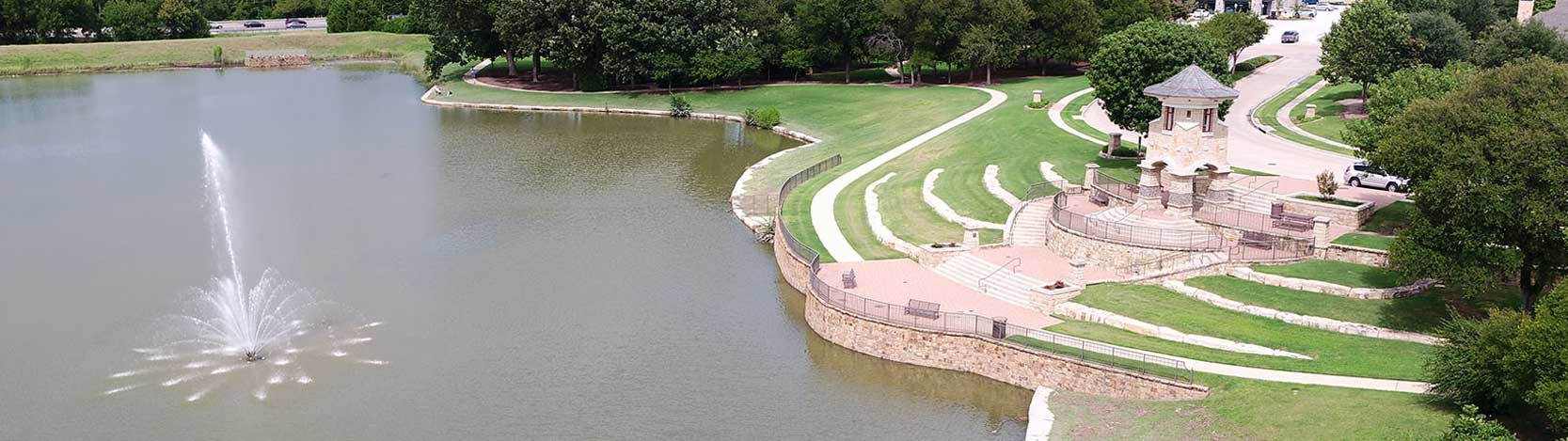 Lake with fountain and overlooking cinema of Stonebridge Ranch Community